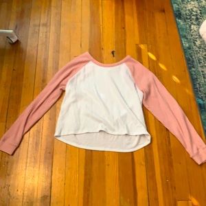 white a land pink long sleeves shirt